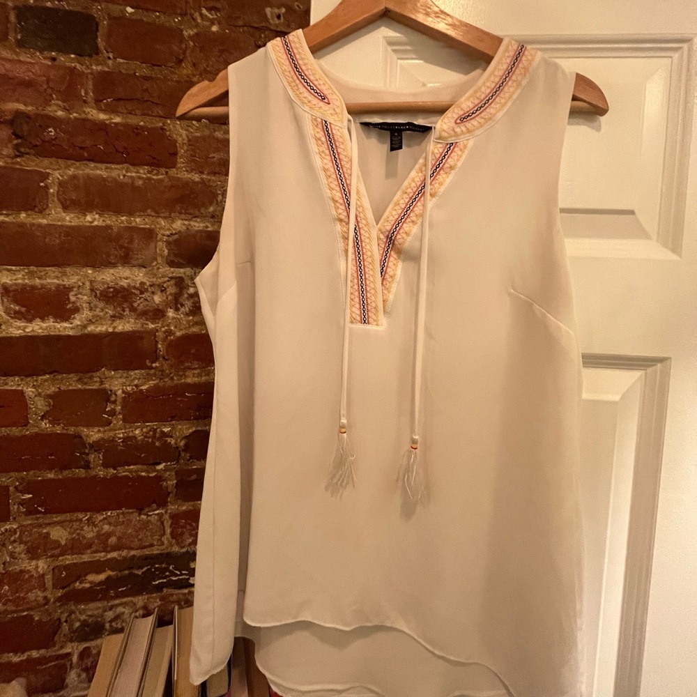 White sleeveless blouse